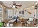 Cozy sunroom with comfortable wicker furniture and ample natural light at 1619 Live Oak Park, Johns Island, SC 29455
