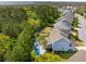 Aerial view of a beautiful backyard featuring a swimming pool, patio, and lush landscaping at 1644 Fort Palmetto Cir, Mount Pleasant, SC 29466