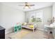 Bright bedroom with a daybed, ceiling fan, and a window with neighborhood views at 1644 Fort Palmetto Cir, Mount Pleasant, SC 29466