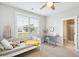 Cozy bedroom with daybed, ceiling fan, and en-suite bathroom access at 1644 Fort Palmetto Cir, Mount Pleasant, SC 29466