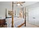 Bedroom featuring a four-poster bed, ceiling fan, and ensuite bathroom at 1644 Fort Palmetto Cir, Mount Pleasant, SC 29466