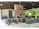 Open-air community gathering space featuring a brick fireplace, ceiling fans, and ample seating at 1644 Fort Palmetto Cir, Mount Pleasant, SC 29466