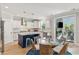 Bright kitchen features a breakfast nook with a glass table and rattan chairs at 1644 Fort Palmetto Cir, Mount Pleasant, SC 29466