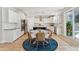 Bright kitchen and dining area featuring a round table, woven chairs, stainless steel appliances, and pendant lights at 1644 Fort Palmetto Cir, Mount Pleasant, SC 29466