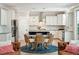 Bright kitchen and dining area featuring a round table, woven chairs, stainless steel appliances, and pendant lights at 1644 Fort Palmetto Cir, Mount Pleasant, SC 29466