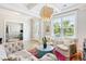 Bright living room featuring stylish furnishings, unique lighting, and wood floors at 1644 Fort Palmetto Cir, Mount Pleasant, SC 29466
