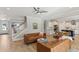 Open-concept living area featuring modern furnishings, wood floors, and seamless access to the bright kitchen at 1644 Fort Palmetto Cir, Mount Pleasant, SC 29466