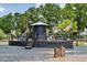 Community play area with creative structures and landscaping, designed for imaginative play at 1644 Fort Palmetto Cir, Mount Pleasant, SC 29466