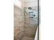 Modern shower featuring gray tiling, rainfall showerhead, and recessed niche at 1644 Fort Palmetto Cir, Mount Pleasant, SC 29466