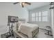 Bright bedroom features a ceiling fan, exercise bike, and plantation shutters, creating a peaceful and functional retreat at 169 Jackson St, Charleston, SC 29403