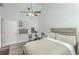 Bright bedroom featuring a ceiling fan, mounted folding desk, and exercise bike for a modern and functional space at 169 Jackson St, Charleston, SC 29403