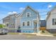 Charming blue two-story home with well-maintained landscaping and a cozy front porch at 169 Jackson St, Charleston, SC 29403