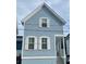 Charming blue two-story home with white trim, shuttered windows, and a welcoming front porch at 169 Jackson St, Charleston, SC 29403