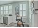 Modern kitchen with stainless steel appliances, quartz counters and a small table at 169 Jackson St, Charleston, SC 29403
