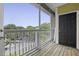 Balcony with screen looking out over parked cars and green trees at 1735 Telfair Way, Charleston, SC 29412
