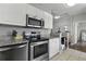 Modern kitchen with stainless steel appliances, granite countertops, and plenty of storage space for cooking essentials at 1735 Telfair Way, Charleston, SC 29412