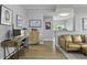 Open concept living room with wood floors and workstation at 1735 Telfair Way, Charleston, SC 29412