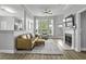 Comfortable living room with fireplace and multiple windows showing exterior greenery at 1735 Telfair Way, Charleston, SC 29412