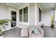Cozy outdoor seating area on balcony with comfortable wicker furniture and view to the interior at 200 River Landing Dr # D310, Charleston, SC 29492