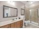 Bathroom features a vanity, a large mirror, and a glass-enclosed shower with tile surround at 200 River Landing Dr # D310, Charleston, SC 29492