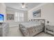 Serene bedroom with plantation shutters, ceiling fan, and soft, neutral tones at 200 River Landing Dr # D310, Charleston, SC 29492