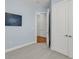 Cozy bedroom with soft blue walls, neutral carpeting, and a glimpse into an adjacent room with hardwood floors at 200 River Landing Dr # D310, Charleston, SC 29492