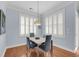 Bright dining area featuring stylish lighting, plantation shutters and seating for four at 200 River Landing Dr # D310, Charleston, SC 29492