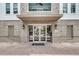 Charming brick building entrance with glass doors and transom windows, under an awning at 200 River Landing Dr # D310, Charleston, SC 29492