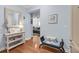 Inviting entryway featuring a wooden console table with decor, a mirror, and a bench at 200 River Landing Dr # D310, Charleston, SC 29492