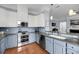 Stylish kitchen with stainless appliances, ample counter space, and wooden floor at 200 River Landing Dr # D310, Charleston, SC 29492