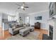 Cozy living room showcasing a comfortable sofa, open to the kitchen, and hardwood flooring at 200 River Landing Dr # D310, Charleston, SC 29492
