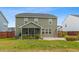 A spacious backyard has a screened-in porch and grassy area at 205 Honey Horn Dr, Summerville, SC 29486