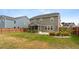 Expansive backyard featuring a screened porch, spacious lawn, and lush landscaping at 205 Honey Horn Dr, Summerville, SC 29486