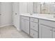 Bathroom with dual vanities, gray cabinets, and a large mirror at 205 Honey Horn Dr, Summerville, SC 29486