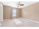 Bedroom with neutral paint, carpet, a window with curtains, and a ceiling fan at 205 Honey Horn Dr, Summerville, SC 29486