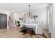 Dining space with a white table, chairs, bench seating, and modern light fixture at 205 Honey Horn Dr, Summerville, SC 29486
