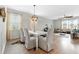 Bright dining area with a white table, stylish chairs, and a decorative light fixture at 205 Honey Horn Dr, Summerville, SC 29486