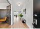Inviting home hallway featuring hardwood floors, decorative lighting, and stylish furnishings with an inviting atmosphere at 205 Honey Horn Dr, Summerville, SC 29486