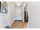 Bright home hallway with hardwood floors, white walls, and decorative accents leading to other rooms in the house at 205 Honey Horn Dr, Summerville, SC 29486