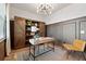 Stylish home office featuring custom built-ins, modern lighting, and a chic workspace for productivity and comfort at 205 Honey Horn Dr, Summerville, SC 29486