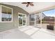 Screened porch with ceiling fan and backyard view at 205 Honey Horn Dr, Summerville, SC 29486