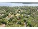 An aerial shot showcasing the property's location near a beautiful lake and tree-lined streets at 2144 Pinopolis Rd, Pinopolis, SC 29469