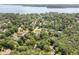 Aerial perspective of a neighborhood close to a lake, surrounded by lush greenery at 2144 Pinopolis Rd, Pinopolis, SC 29469