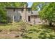 Backyard featuring a stone patio, garden and lush greenery at 2144 Pinopolis Rd, Pinopolis, SC 29469