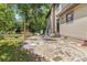 Stone patio in backyard with chairs at 2144 Pinopolis Rd, Pinopolis, SC 29469