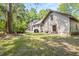 A large backyard with mature trees offering plenty of shade and outdoor space at 2144 Pinopolis Rd, Pinopolis, SC 29469