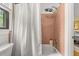 This bathroom offers a peach tile surround and shower, and neutral decor at 2144 Pinopolis Rd, Pinopolis, SC 29469