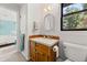 This bathroom offers a wood vanity and cabinet at 2144 Pinopolis Rd, Pinopolis, SC 29469