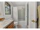 Bright bathroom featuring a shower-tub combination, single sink vanity, and tiled flooring at 2144 Pinopolis Rd, Pinopolis, SC 29469