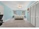 Spacious bedroom with blue walls, two windows, ceiling fan, carpet and a closet at 2144 Pinopolis Rd, Pinopolis, SC 29469